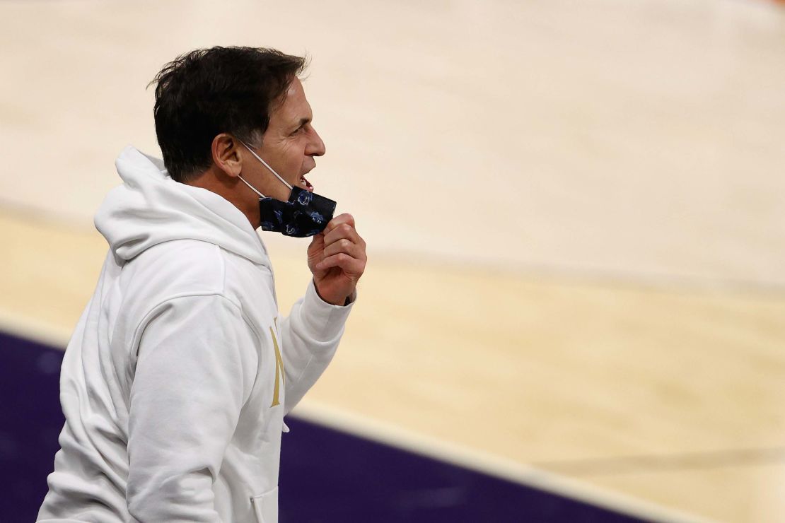 Mavericks owner Cuban reacts to players during an NBA game against the Phoenix Suns.