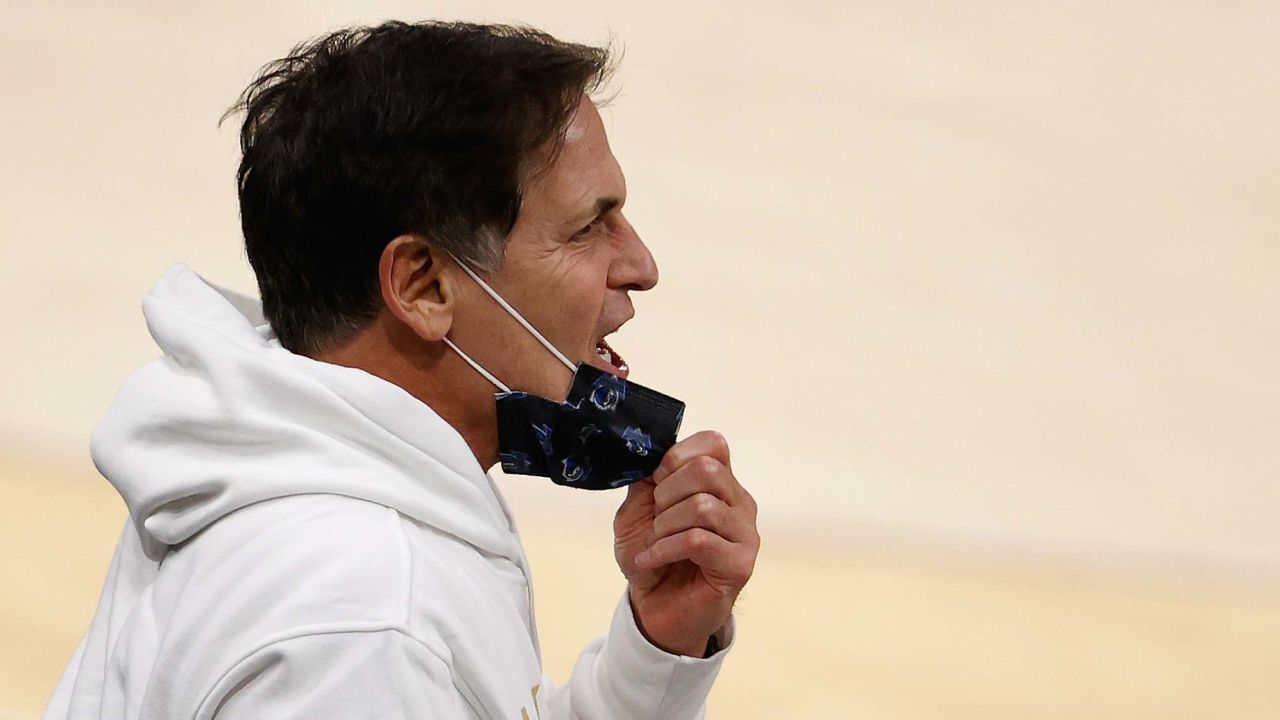 Mavericks owner Cuban reacts to players during an NBA game against the Phoenix Suns.