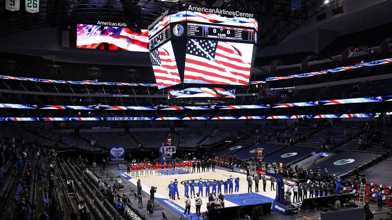 The Mavericks and the Atlanta Hawks stand for the National Anthem prior to tipoff of their NBA game.