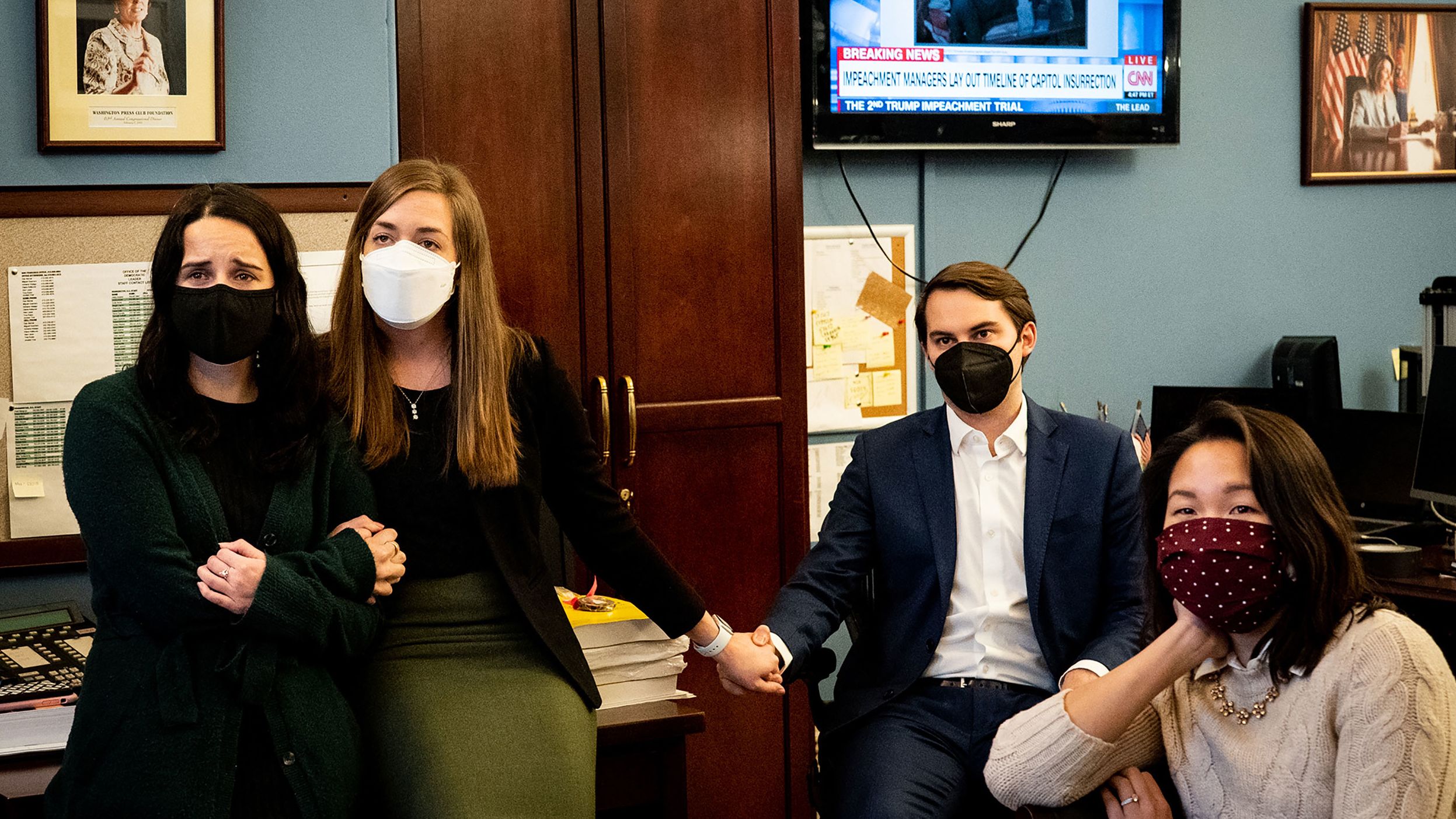 Members of Pelosi's staff watch new footage of the attack on Wednesday, February 10. The footage was part of the case presented by House impeachment managers.
