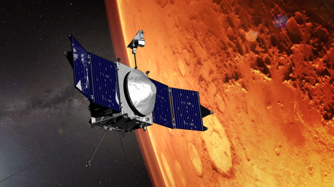 This artist's concept shows the MAVEN spacecraft as it orbits the red planet.