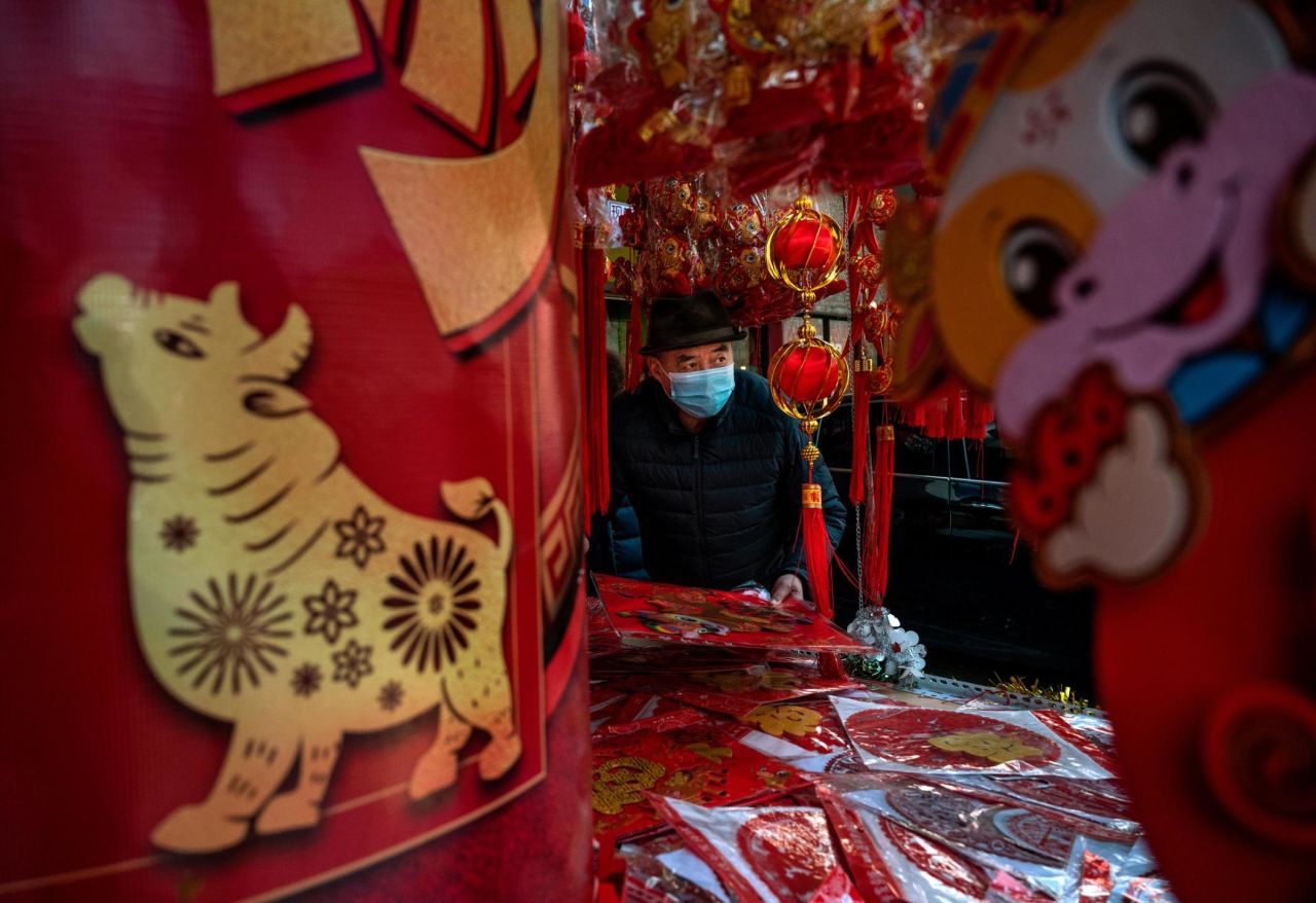 A man in Beijing shops for festive decorations on February 9.