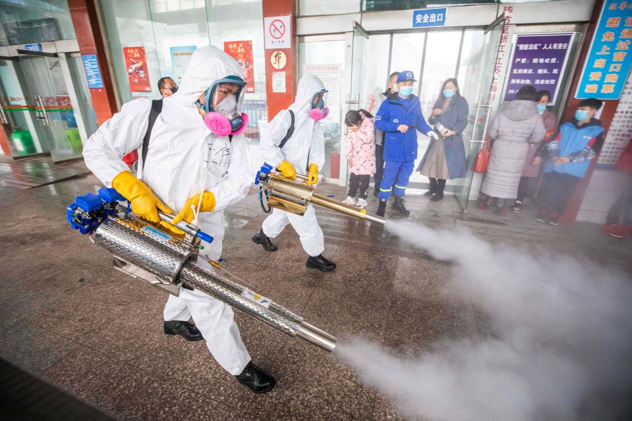 Workers disinfect a bus station in Bijie, China, on February 7 as they prepare for Lunar New Year travel.