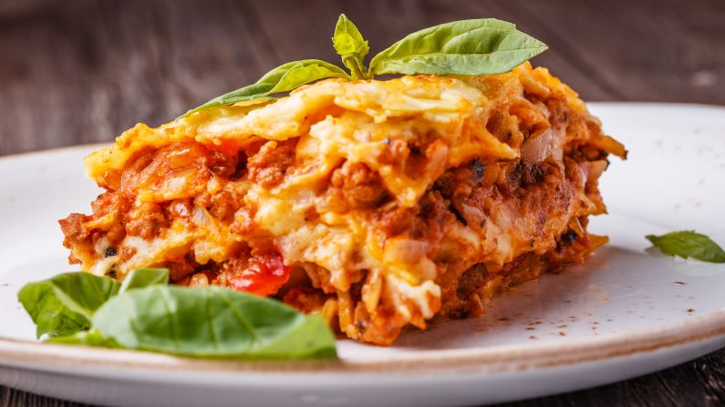 <strong>Lasagne: </strong>Rich layers of ragù, béchamel sauce and Parmigiano cheese oozing between hand-made "sfoglia" sheets of fresh flat pasta.