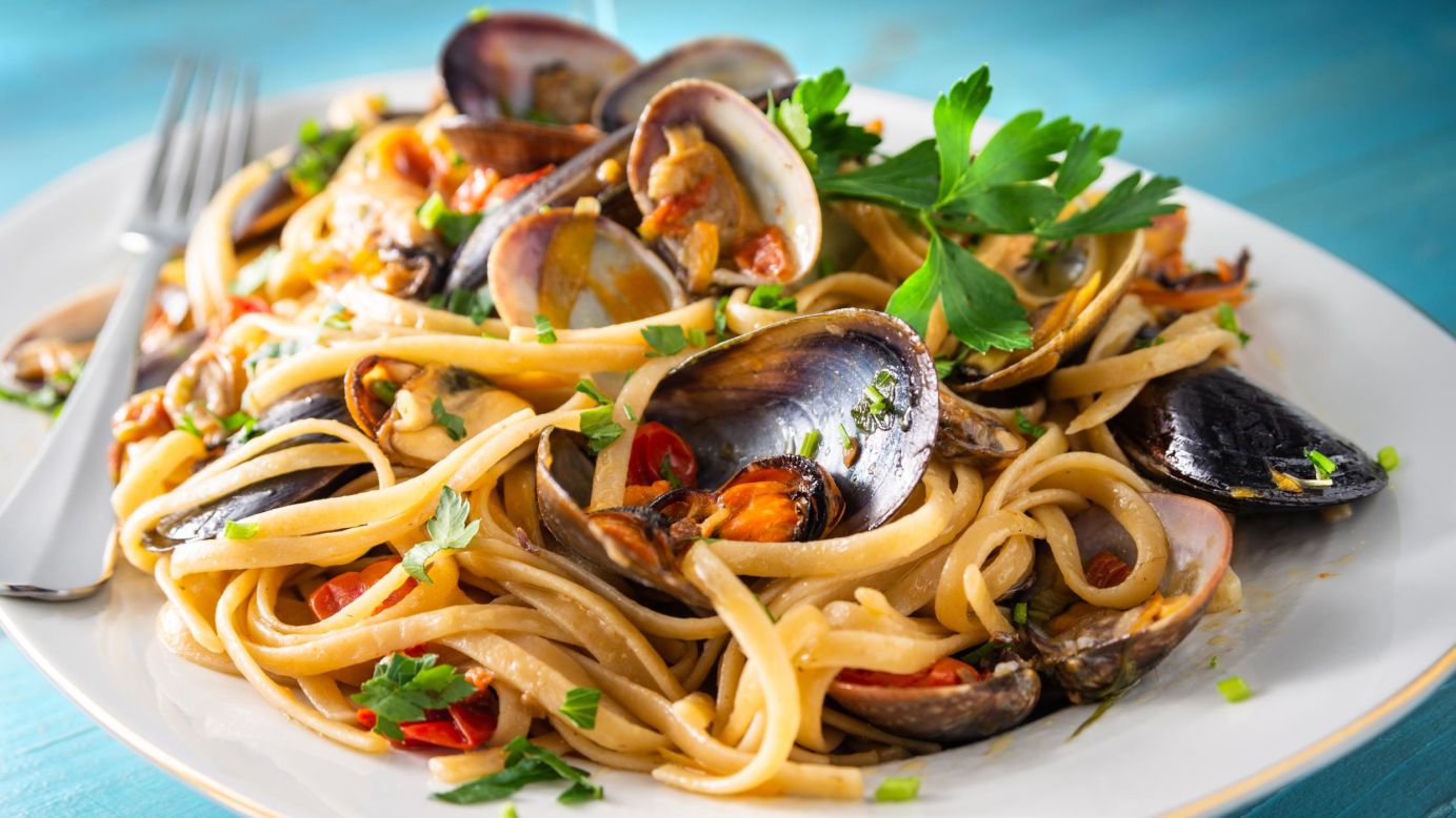 <strong>Linguine allo scoglio: </strong>Linguine entwined with calamari, clams, mussels, shrimp and baby prawns and dressed with chili pepper, parsley, tomatoes and a glug of white wine. 