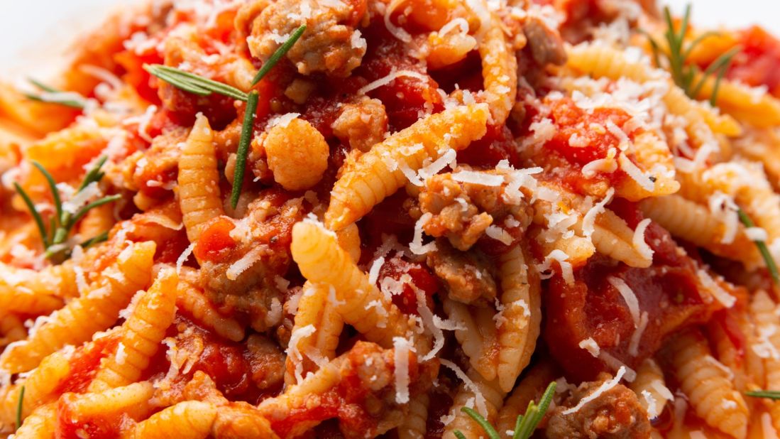 <strong>Malloreddus alla Campidanese: </strong>Tiny pasta shells served with a sauce of onions, sausage ragù or dried salami and dressed with salty Sardinian pecorino cheese. 