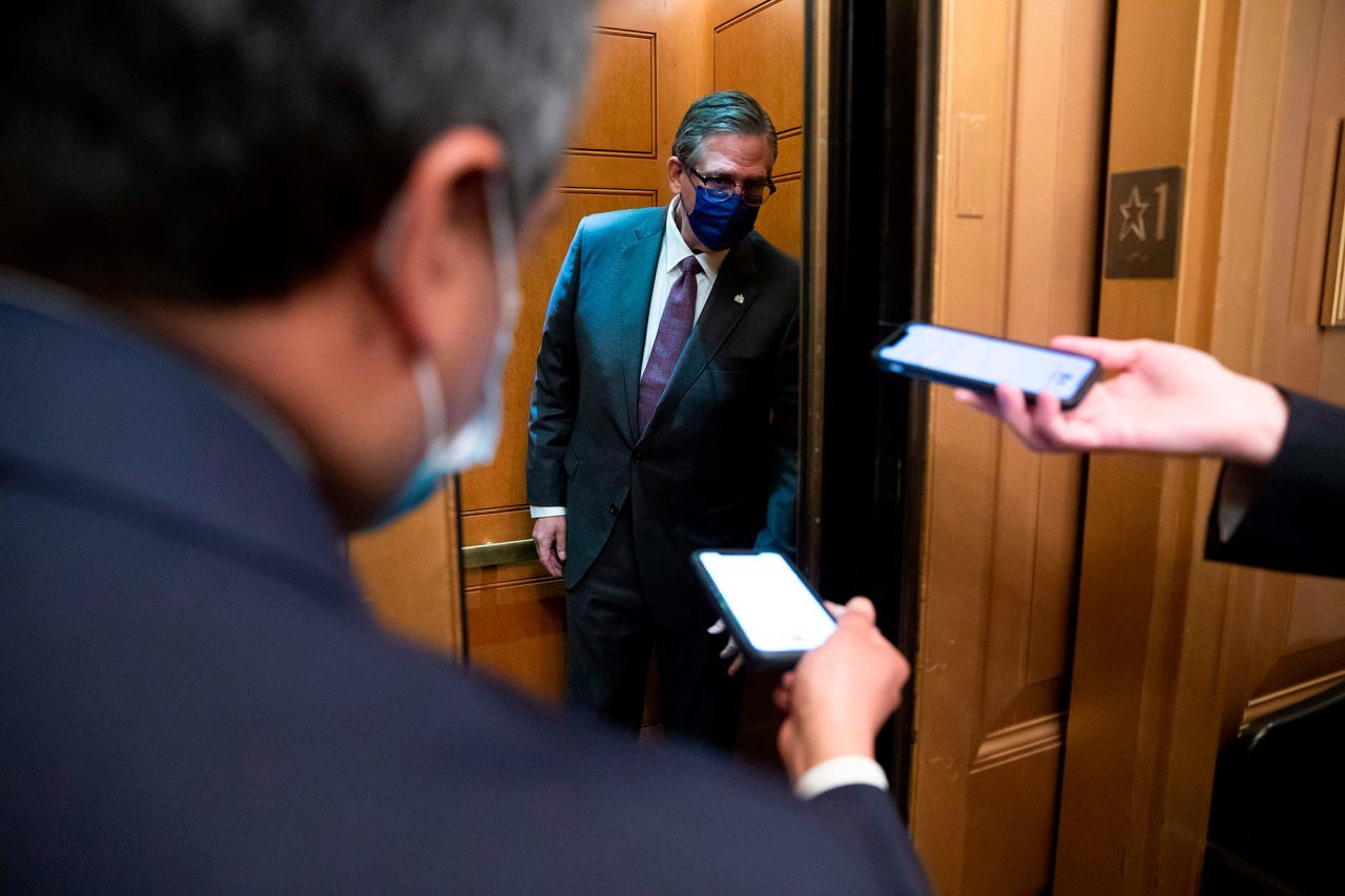 Bruce Castor, one of Trump's lawyers, is followed by members of the media as he enters an elevator at the Capitol on Thursday.