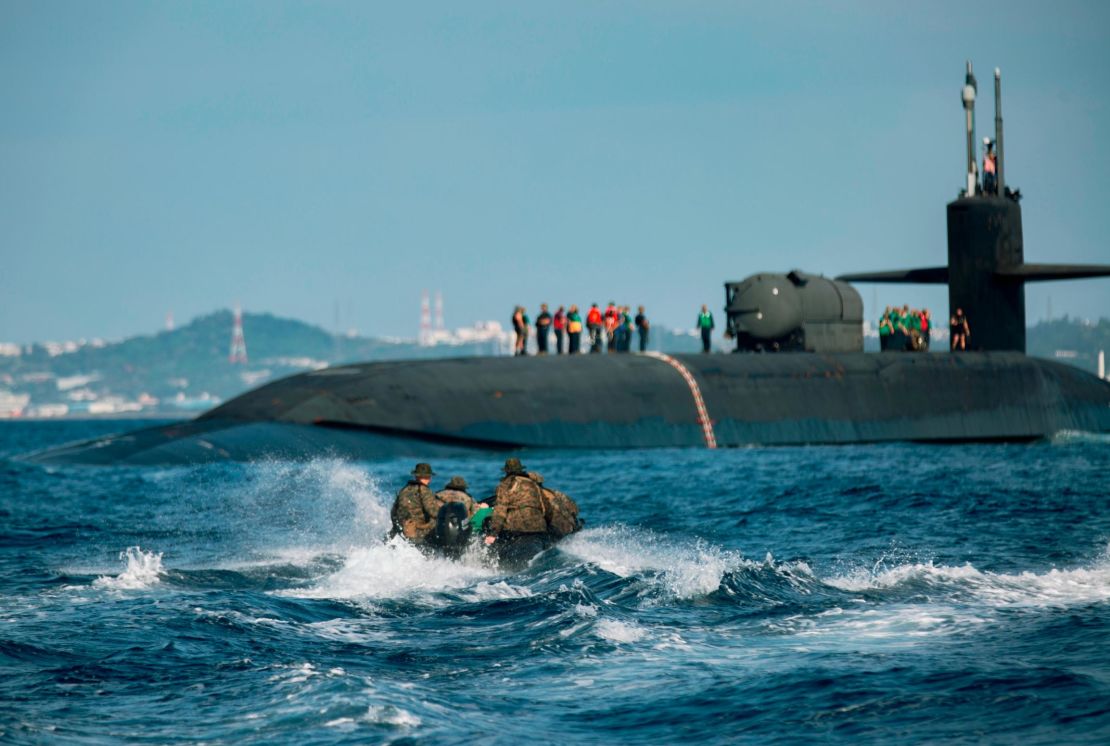 US Marines utilize combat rubber raiding crafts to approach the USS Ohio during an integration exercise off the coast of Okinawa, Japan, this month. 