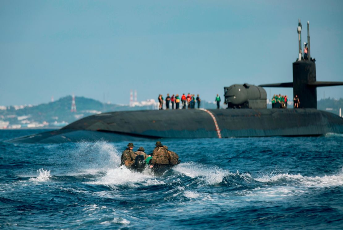 US Marines utilize combat rubber raiding crafts to approach the USS Ohio during an integration exercise off the coast of Okinawa, Japan, this month.