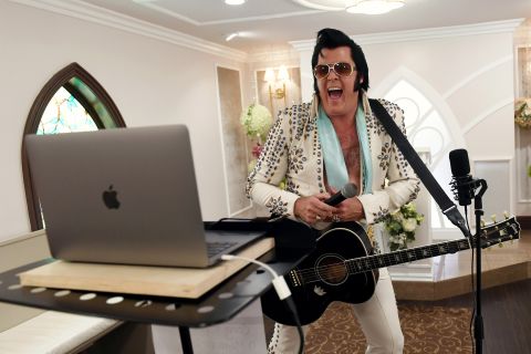 Elvis Presley impersonator and chapel co-owner Brendan Paul performs a vow renewal ceremony in Las Vegas using video-conferencing software on July 28.