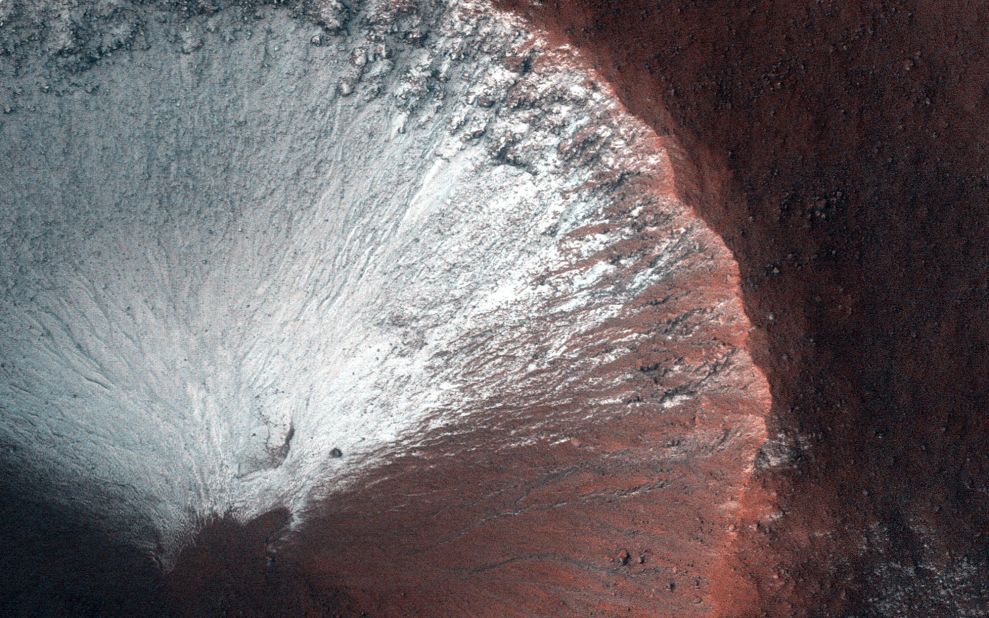 HiRISE took this image of a kilometer-size crater in the southern hemisphere of Mars in June 2014. The crater shows frost on all its south-facing slopes in late winter as Mars is heading into spring.