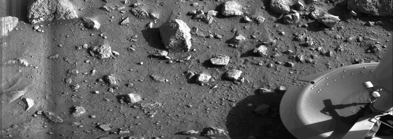 Taken by the Viking 1 lander shortly after it touched down on Mars, this image is the first photograph ever taken from the surface of Mars. It was taken on July 20, 1976.