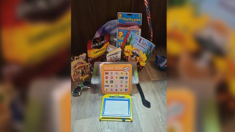 Vincent took her son to a dollar store to pick out items, including a magnetic doodle board and a road sign bingo game, to ease his boredom during her deliveries.