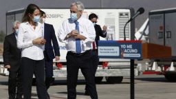 President of Chile Sebastian Piñera walks next to a vaccine container during the arrival of around 1.92 million of CoronaVac vaccine doses on January 28, 2021 in Santiago, Chile. 