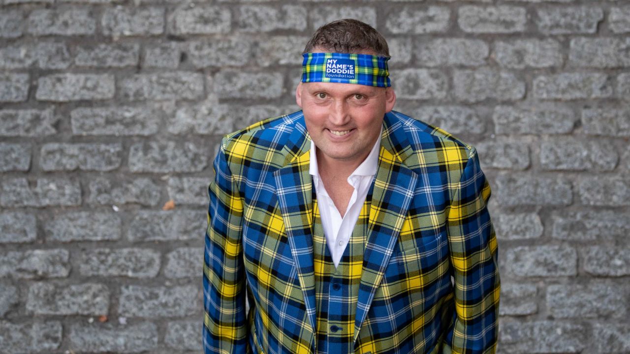 Weir has become known for his colourful tartan suits.