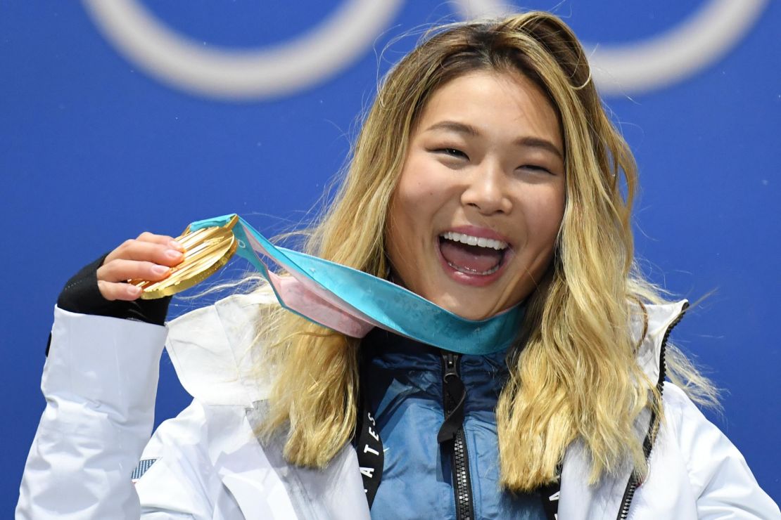 USA's gold medallist Chloe Kim poses on the podium at the 2018 Winter Olympic Games.