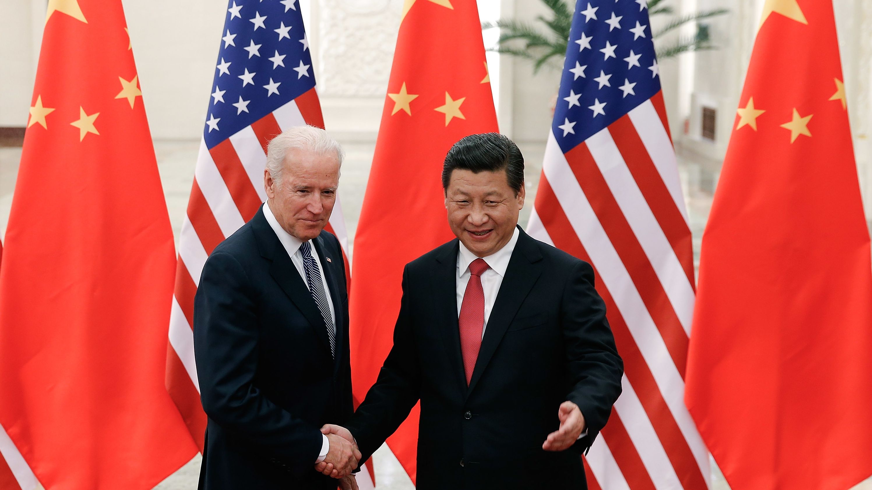 Then Vice-President Joe Biden shakes hands with Chinese leader Xi Jinping during a visit to Beijing in 2013. 