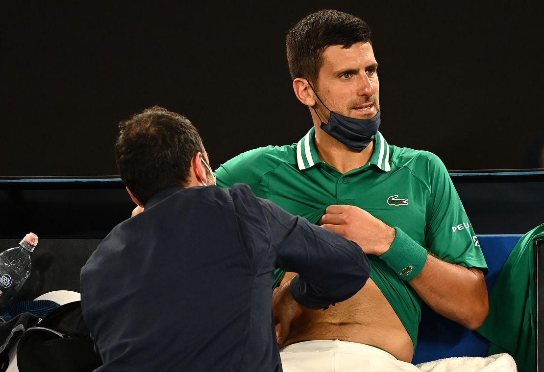 Djokovic receives treatment during his third-round game.