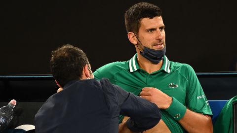 Djokovic receives treatment during his third-round game.