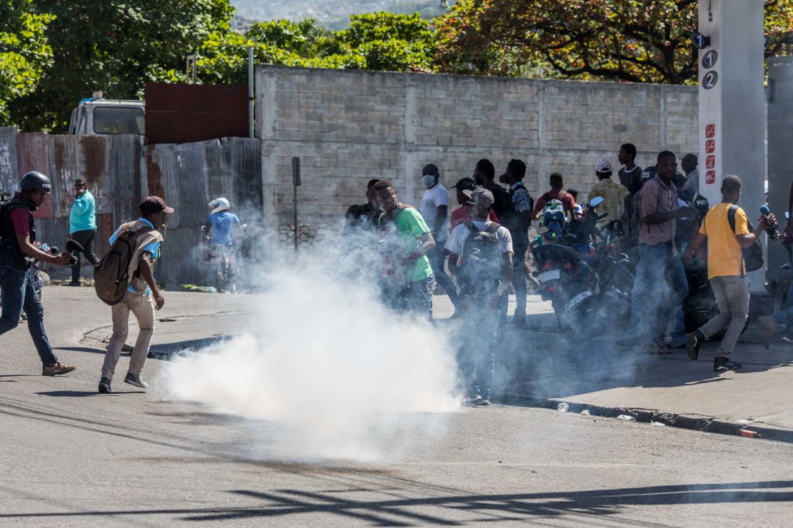 Police fire tear gas during a march in Port-au-Prince on February 10, 2021, to protest against the government of President Jovenel Moise. 