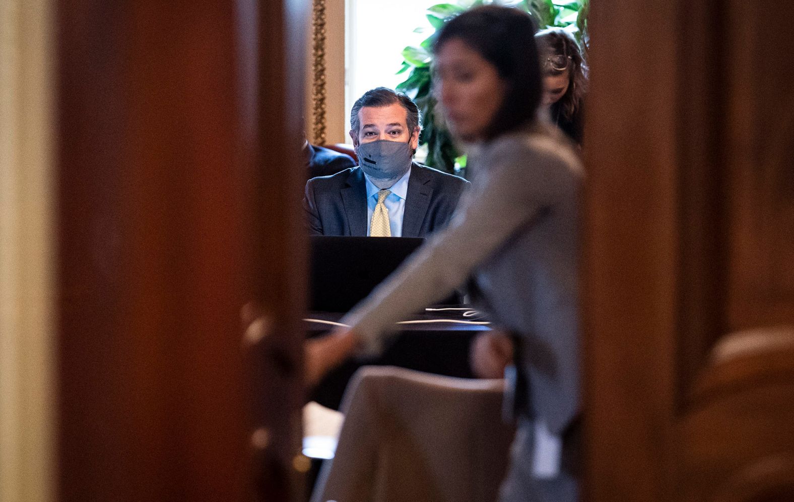 US Sen. Ted Cruz sits in front of a computer as he meets with Donald Trump's lawyers during a break in the trial on Friday. Cruz was part of a group of Republican senators <a href="index.php?page=&url=https%3A%2F%2Fwww.cnn.com%2Fpolitics%2Flive-news%2Ftrump-impeachment-trial-02-12-2021%2Fh_f4d65af9a101e1eca296adb937436e76" target="_blank">who had been actively counseling the Trump legal team.</a>