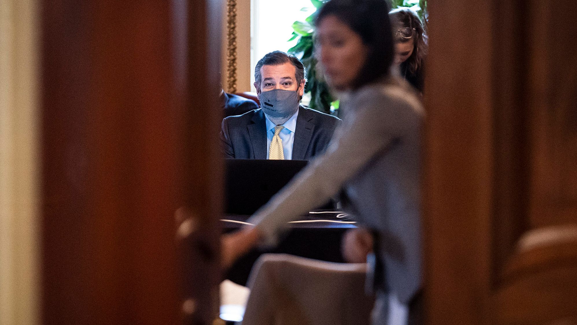 US Sen. Ted Cruz sits in front of a computer as he meets with Donald Trump's lawyers during a break in the trial on Friday. Cruz was part of a group of Republican senators <a href="https://www.cnn.com/politics/live-news/trump-impeachment-trial-02-12-2021/h_f4d65af9a101e1eca296adb937436e76" target="_blank">who had been actively counseling the Trump legal team.</a>
