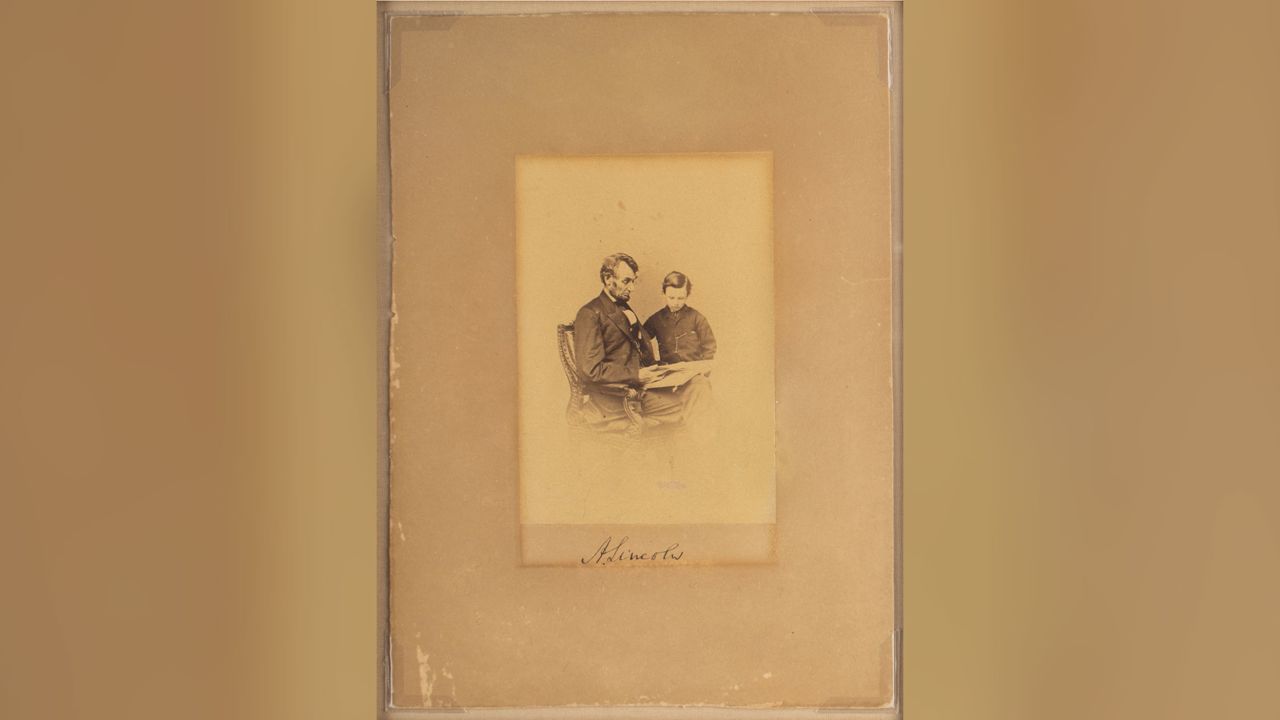 Original albumen 3.75ʺ x 5.25ʺ photograph of President Abraham Lincoln with his son Tad, taken by Mathew Brady on February 9, 1864.