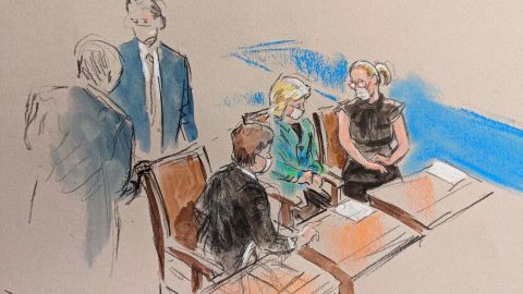 Sen. Susan Collins, Sen. Lisa Murkowski, and Sen. Kyrsten Sinema (seated, left to right) during a break in the impeachment trial.