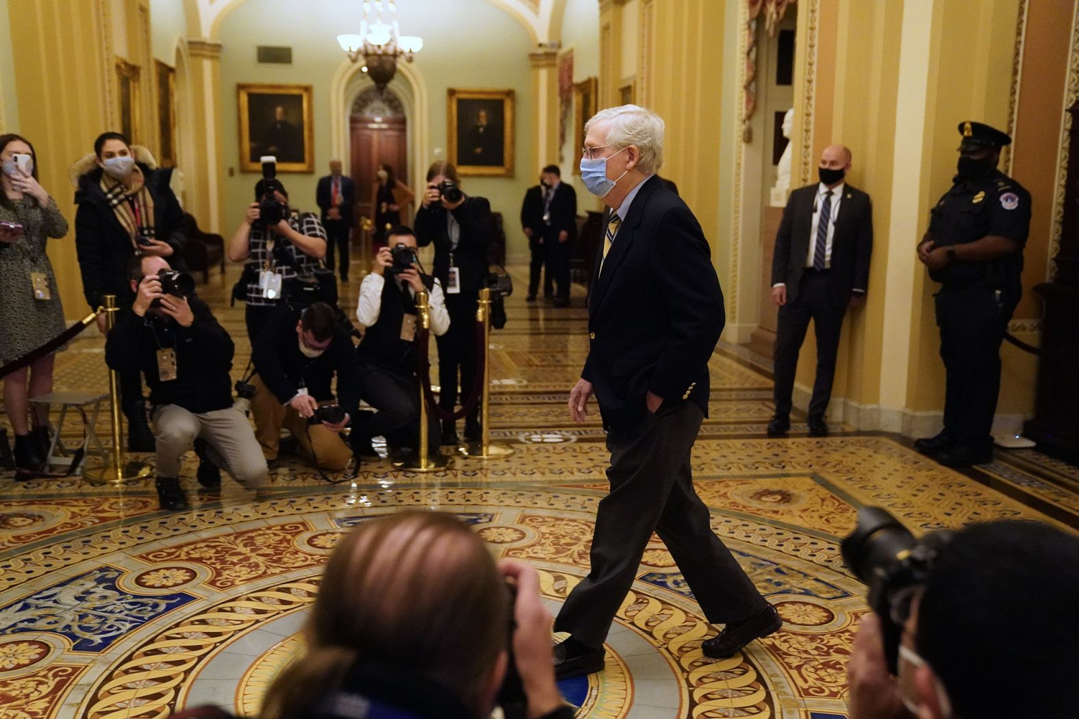 Senate Minority Leader Mitch McConnell walks to the Senate Chamber on Saturday. McConnell <a href="index.php?page=&url=https%3A%2F%2Fwww.cnn.com%2F2021%2F02%2F13%2Fpolitics%2Fmitch-mcconnell-acquit-trump%2Findex.html" target="_blank">voted not guilty,</a> saying he didn't think the Senate had the "power to convict and disqualify a former office holder who is now a private citizen." But he still put blame on Trump. "There's no question — none — that President Trump is practically and morally responsible for provoking the events of the day," <a href="index.php?page=&url=https%3A%2F%2Fwww.cnn.com%2Fpolitics%2Flive-news%2Ftrump-impeachment-trial-02-13-2021%2Fh_1f51fbdbd5a745e9151383b8f34cf65a" target="_blank">McConnell said.</a> "No question about it. The people who stormed this building believed they were acting on the wishes and instructions of their President."