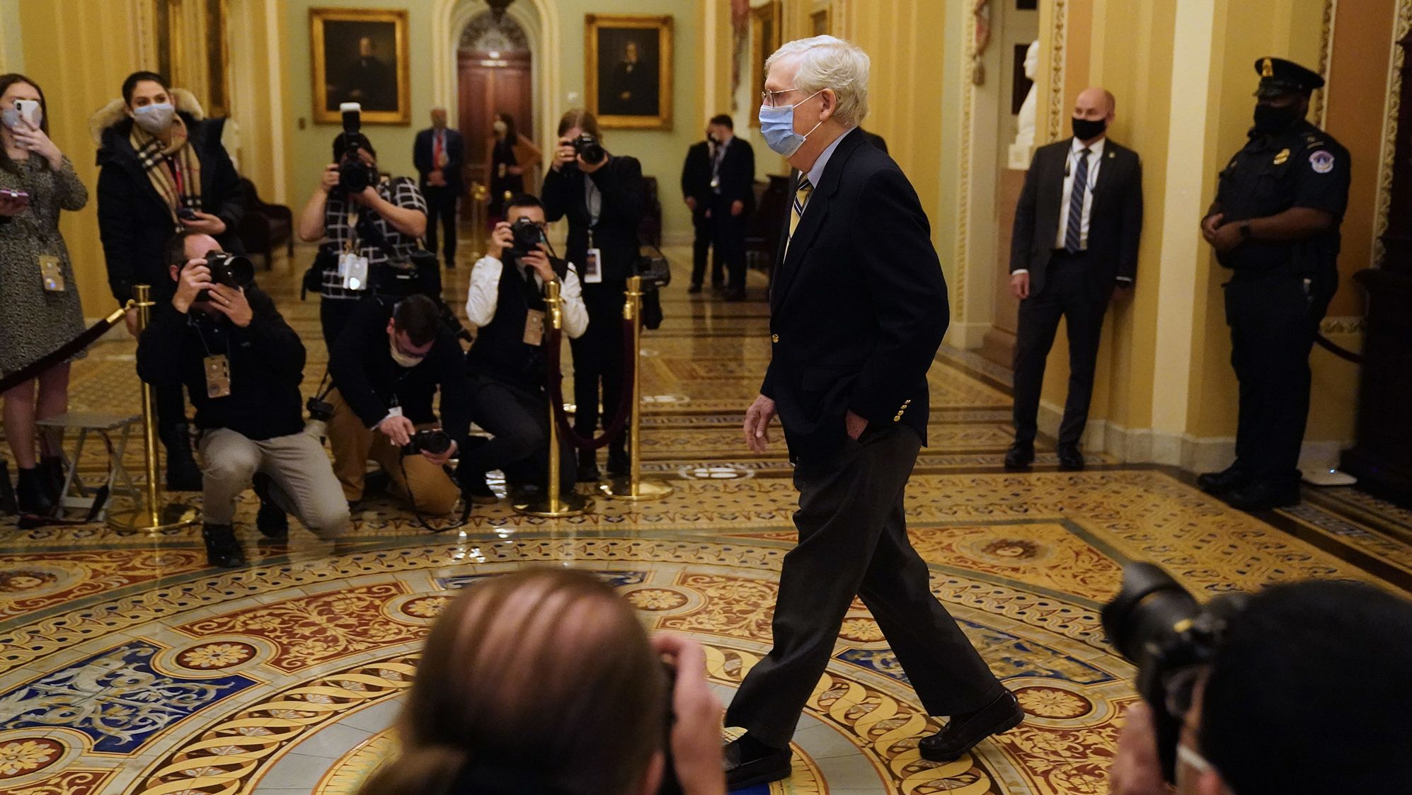Senate Minority Leader Mitch McConnell walks to the Senate Chamber on Saturday. McConnell <a href="https://www.cnn.com/2021/02/13/politics/mitch-mcconnell-acquit-trump/index.html" target="_blank">voted not guilty,</a> saying he didn't think the Senate had the "power to convict and disqualify a former office holder who is now a private citizen." But he still put blame on Trump. "There's no question — none — that President Trump is practically and morally responsible for provoking the events of the day," <a href="https://www.cnn.com/politics/live-news/trump-impeachment-trial-02-13-2021/h_1f51fbdbd5a745e9151383b8f34cf65a" target="_blank">McConnell said.</a> "No question about it. The people who stormed this building believed they were acting on the wishes and instructions of their President."