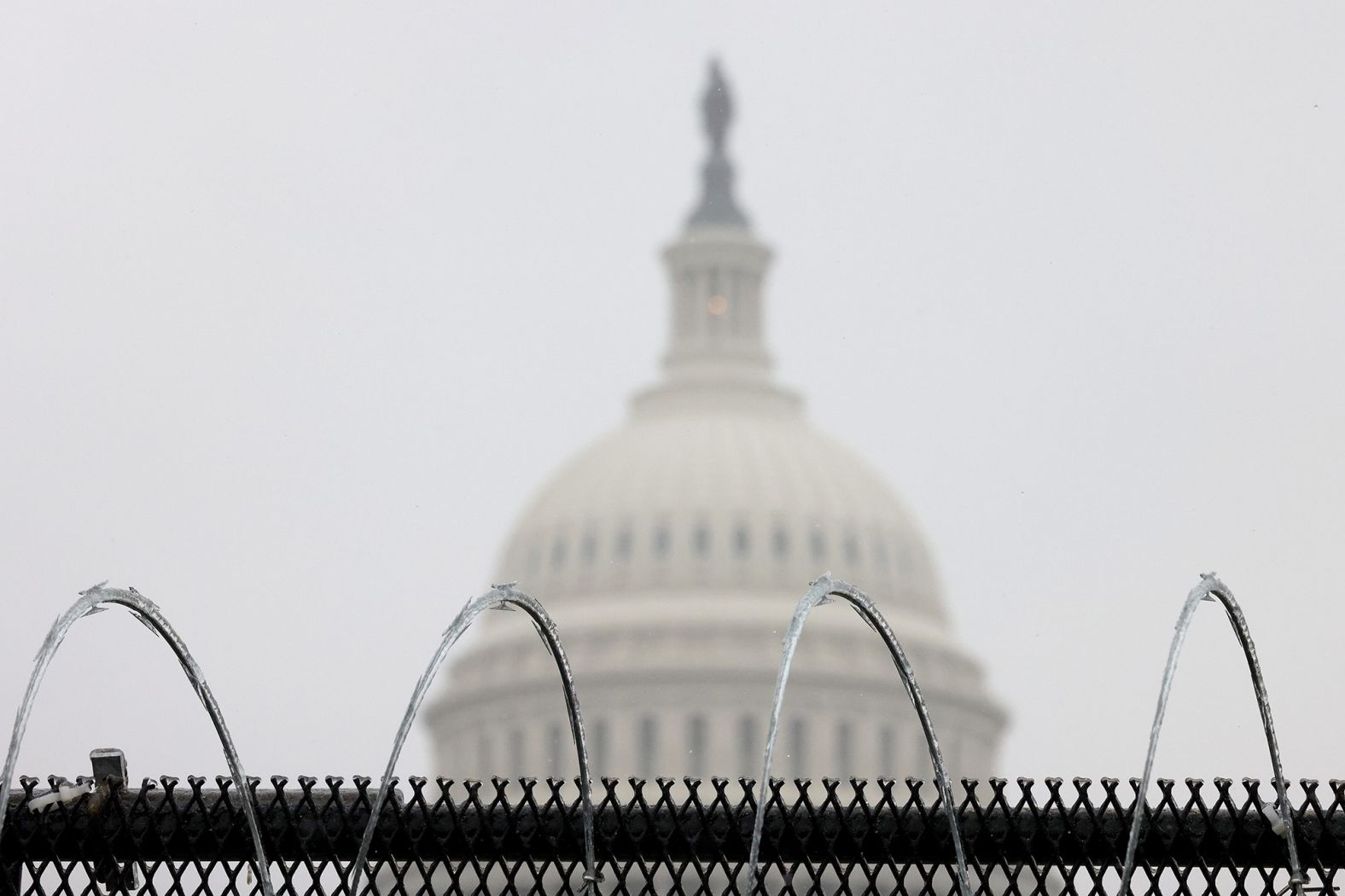 Razor wire is shown atop a fence outside the Capitol on Saturday. There has been extraordinary security inside and outside the Capitol this week.