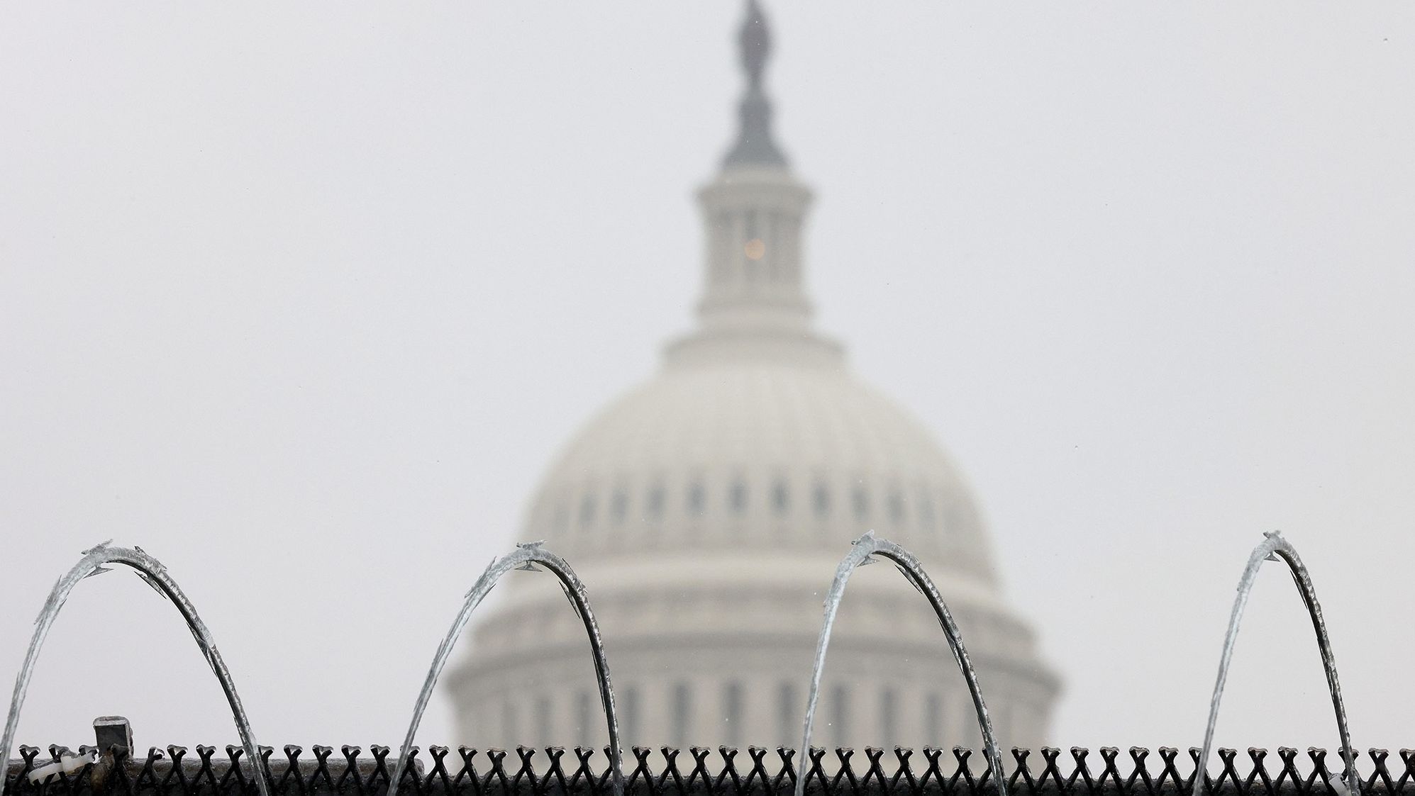 Razor wire is shown atop a fence outside the Capitol on Saturday. There has been extraordinary security inside and outside the Capitol this week.