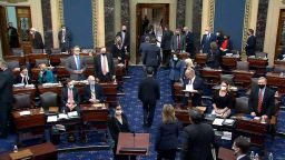 WASHINGTON, DC - FEBRUARY 13: In this screenshot taken from a congress.gov webcast, the House impeachment managers are escorted out after the Senate voted 57-43 to acquit on the fifth day of former President Donald Trump's second impeachment trial at the U.S. Capitol on February 13, 2021 in Washington, DC. House impeachment managers had argued that Trump was "singularly responsible" for the January 6th attack at the U.S. Capitol and he should be convicted and barred from ever holding public office again. (Photo by congress.gov via Getty Images)