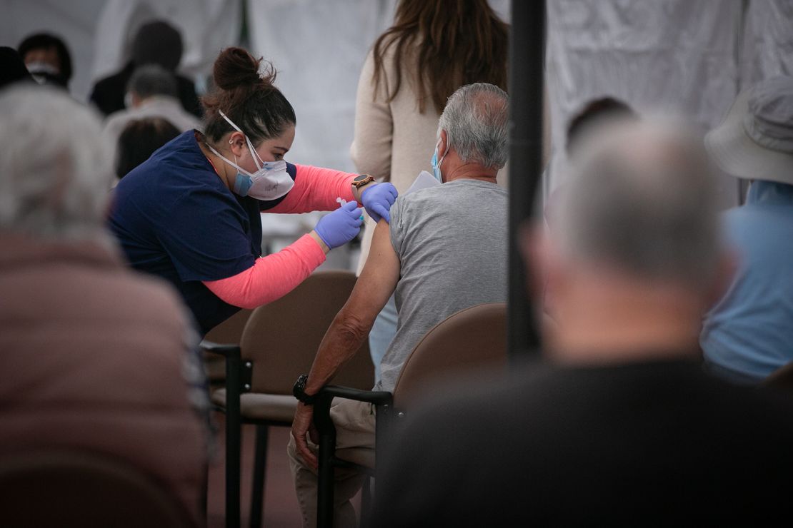 A nurse administers  a Covid-19 vaccine at Kedren Health on Thursday in Los Angeles.