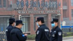 Security personnel stand guard outside the Wuhan Institute of Virology in Wuhan as members of the World Health Organization (WHO) team investigating the origins of the COVID-19 coronavirus make a visit to the institute in Wuhan in China's central Hubei province on February 3, 2021. (Photo by Hector RETAMAL / AFP) (Photo by HECTOR RETAMAL/AFP via Getty Images)