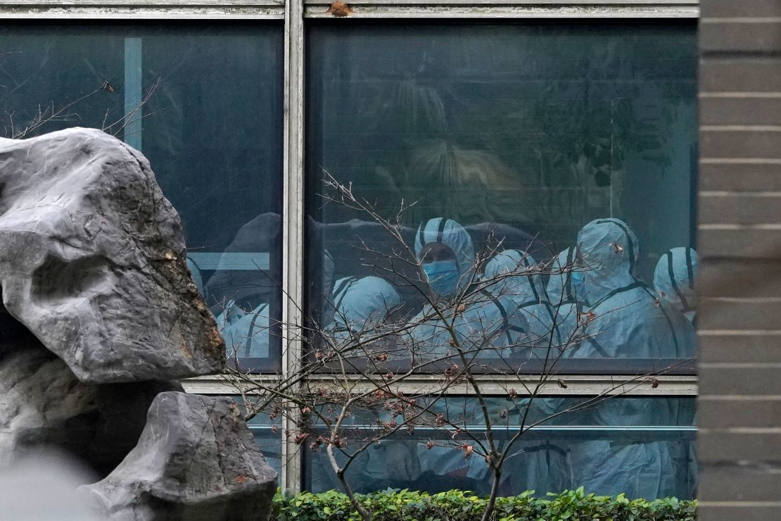 Members of a WHO team wear protective gear during a field visit to the Hubei Animal Disease Control and Prevention Center on February 2, 2021.