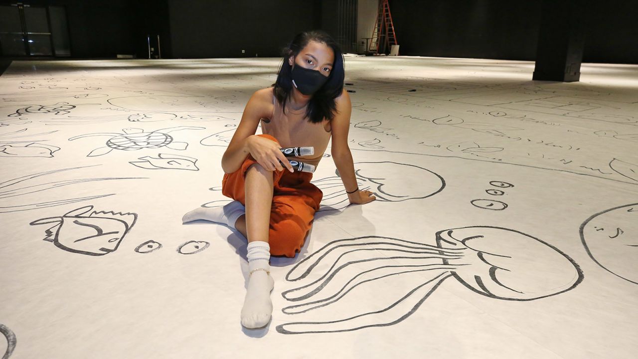 Art teacher and artist Dyymond Whipper-Young recently completed the world's largest drawing by an individual.