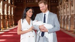 WINDSOR, ENGLAND - MAY 08: Prince Harry, Duke of Sussex and Meghan, Duchess of Sussex, pose with their newborn son Archie Harrison Mountbatten-Windsor during a photocall in St George's Hall at Windsor Castle on May 8, 2019 in Windsor, England. The Duchess of Sussex gave birth at 05:26 on Monday 06 May, 2019. (Photo by Dominic Lipinski - WPA Pool/Getty Images)