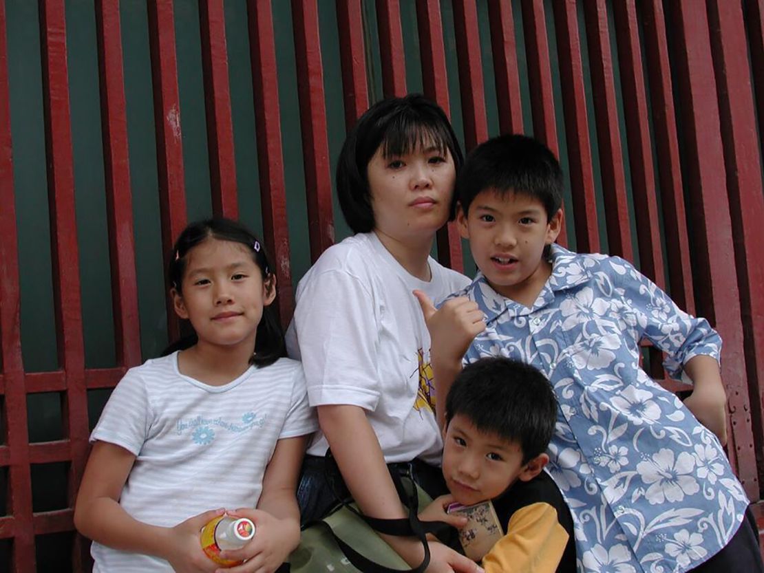 Kumamoto is the youngest of three siblings, all seen here with their mother.