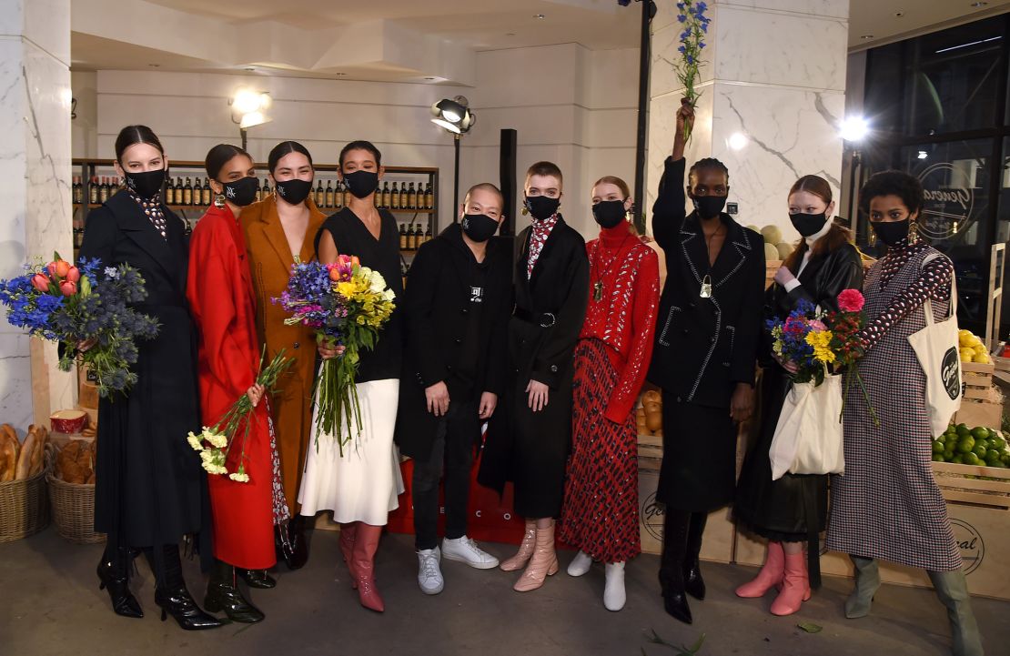 Designer Jason Wu poses with models at his latest show in New York on February 14, 2021. 