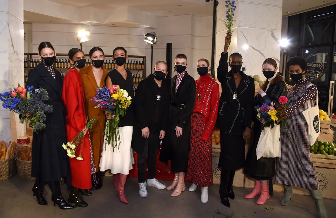Designer Jason Wu poses with models at his latest show in New York on February 14, 2021.
