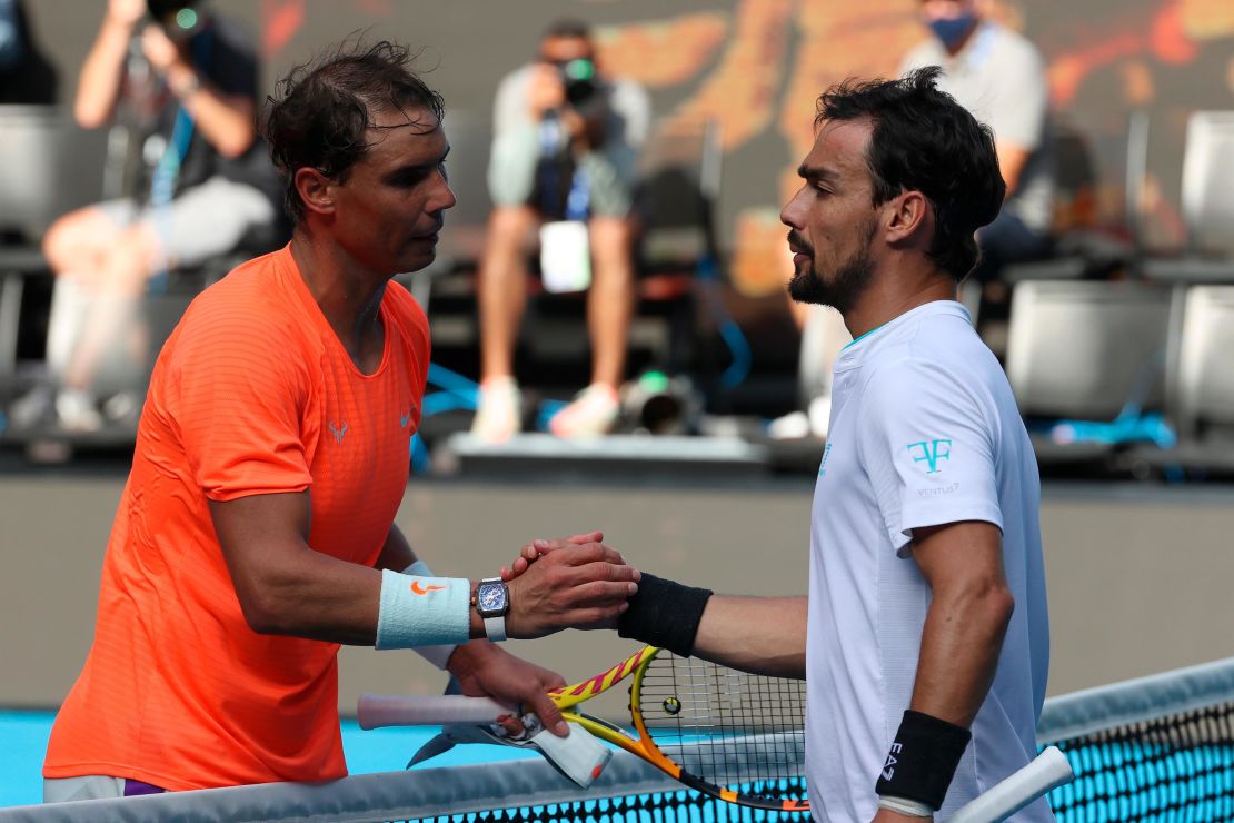 Nadal (left) shakes hands with  Fognini after their men's singles match.