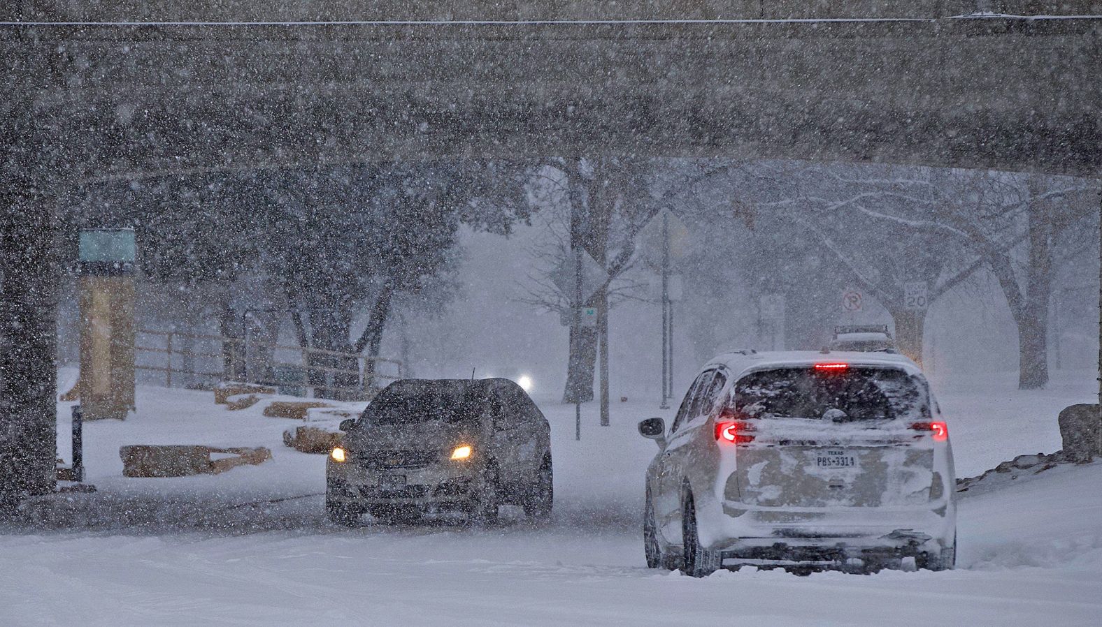 A few cars drive in San Angelo, Texas, on Sunday, February 14.