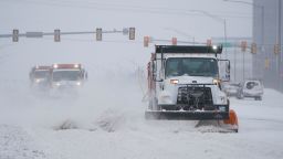 Snowplows works to clear the road in Oklahoma City on Sunday, February 14.