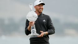 PEBBLE BEACH, CALIFORNIA - FEBRUARY 14: Daniel Berger of the United States celebrates with the trophy after winning during the final round of the AT&T Pebble Beach Pro-Am at Pebble Beach Golf Links on February 14, 2021 in Pebble Beach, California. (Photo by Steph Chambers/Getty Images)