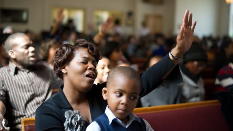 Worshippers sing hymns during a service at the First Church of Seventh Day Adventists in Washington.