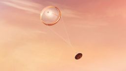 NASA's Perseverance rover deploys a supersonic parachute from its aeroshell as it slows down before landing, in this artist's illustration. Hundreds of critical events must execute perfectly and exactly on time for the rover to land safely on Feb. 18, 2021.
