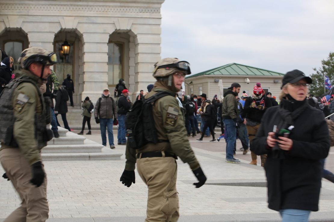 Watkins, center, and Crowl, left, were among alleged Oath Keepers who wore body armor and the group's insignia at the Capitol on January 6.