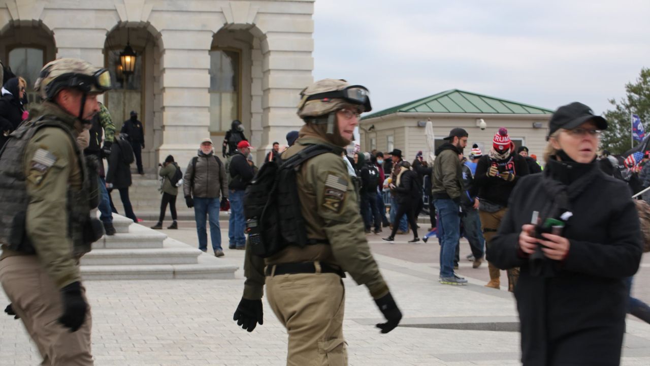 Watkins, center, and Crowl, left, were among alleged Oath Keepers who wore body armor and the group's insignia at the Capitol on January 6.