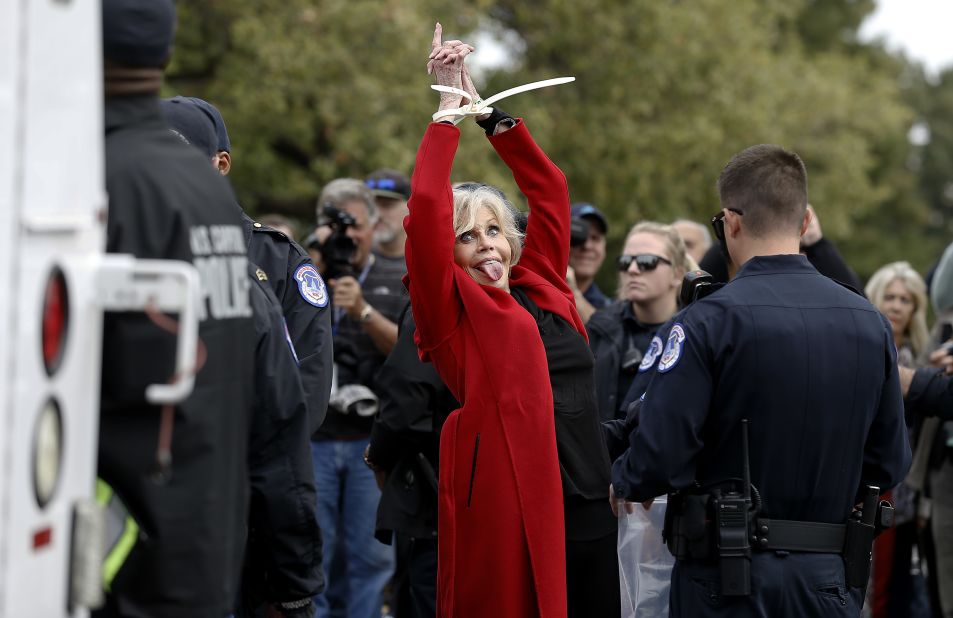 Fonda is taken away in ziptie handcuffs as she is arrested during a climate crisis protest at the US Capitol in October 2019. It was her third consecutive week getting arrested at what she called her "Fire Drill Fridays" protests. "We have to behave like our house is on fire, because it is," Fonda said, referencing a phrase often said by teenage climate activist Greta Thunberg. Fonda was arrested five times from October 2019 to December 2019.